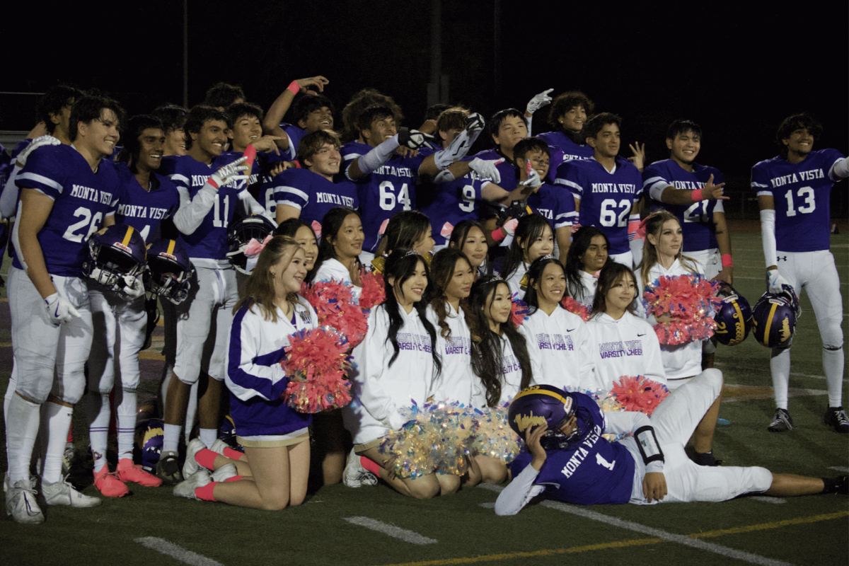 MVHS Cheer and Football teams pose at the end of the game for a group photo.